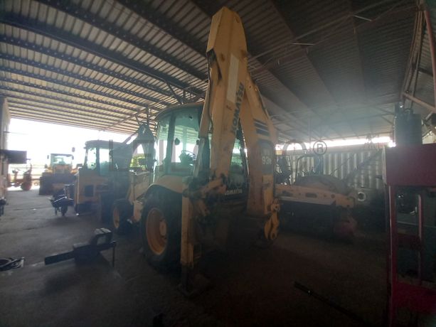 Conj. Ind. Pá e Retro de Pneus da marca KOMATSU, modelo WB93R-5